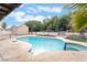 Inviting backyard pool and patio, perfect for relaxation and outdoor enjoyment under a bright sky at 7009 Rawlins Ct, Las Vegas, NV 89128