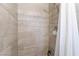 Tiled shower enclosure with shower curtain at 7009 Rawlins Ct, Las Vegas, NV 89128