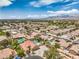 Sprawling neighborhood with mountain views featuring residential homes and swimming pools at 7427 Page Ranch Ct, Las Vegas, NV 89131