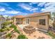 Outdoor space with a well-maintained garden and covered patio at 7427 Page Ranch Ct, Las Vegas, NV 89131