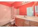 Bathroom featuring a bathtub with shower, toilet, vanity, and mirror at 7427 Page Ranch Ct, Las Vegas, NV 89131