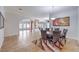 Spacious dining room featuring tiled floors, a decorative rug, and lots of open space at 7427 Page Ranch Ct, Las Vegas, NV 89131