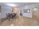 Formal dining area featuring tile flooring, a decorative rug and direct access to other living spaces at 7427 Page Ranch Ct, Las Vegas, NV 89131