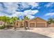 Charming home with a well-manicured front yard, mature palms and a two-car garage at 7427 Page Ranch Ct, Las Vegas, NV 89131