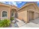 Inviting front entrance showcasing a well-maintained home with a manicured lawn and a two-car garage at 7427 Page Ranch Ct, Las Vegas, NV 89131