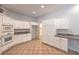 Efficient kitchen featuring white cabinetry, granite countertops, and stainless steel appliances at 7427 Page Ranch Ct, Las Vegas, NV 89131