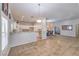 Open-concept kitchen featuring a breakfast bar, tile flooring, and plenty of cabinet space at 7427 Page Ranch Ct, Las Vegas, NV 89131