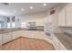 Functional kitchen featuring a breakfast bar, granite counters, and stainless steel appliances at 7427 Page Ranch Ct, Las Vegas, NV 89131