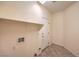 Practical laundry room with shelving, tile flooring, and utility connections at 7427 Page Ranch Ct, Las Vegas, NV 89131
