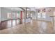 Bright and airy living area with tiled floors and access to the dining area with hard wood floors at 7427 Page Ranch Ct, Las Vegas, NV 89131