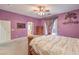 Relaxing main bedroom featuring carpet floors and private access to the backyard at 7427 Page Ranch Ct, Las Vegas, NV 89131