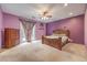 Spacious main bedroom with ceiling fan, carpet flooring, and private access to the backyard at 7427 Page Ranch Ct, Las Vegas, NV 89131