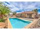 Stunning backyard pool with mature landscaping and a gazebo perfect for outdoor entertaining at 7427 Page Ranch Ct, Las Vegas, NV 89131