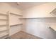 Walk-in closet with built-in shelves and racks provides ample storage space at 7427 Page Ranch Ct, Las Vegas, NV 89131