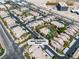 Aerial view of a well-maintained apartment complex with a central pool, lush landscaping, and ample parking at 8000 Badura Ave # 2174, Las Vegas, NV 89113
