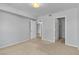 Neutral bedroom featuring a large window, carpet floors, and white painted walls and doors at 8000 Badura Ave # 2174, Las Vegas, NV 89113