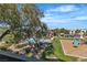 Community pool and playground amongst mature trees at 8000 Badura Ave # 2174, Las Vegas, NV 89113