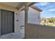 Exterior door and porch with textured walls at 8000 Badura Ave # 2174, Las Vegas, NV 89113