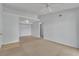 Living room with neutral carpet and a view of a doorway, closet, and tiled area at 8000 Badura Ave # 2174, Las Vegas, NV 89113