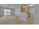 Bright living room with sliding glass doors to balcony and adjacent kitchen space at 8000 Badura Ave # 2174, Las Vegas, NV 89113