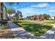 Well-maintained community playground area with modern play equipment and lush green space for to play at 8000 Badura Ave # 2174, Las Vegas, NV 89113