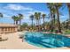 Inviting community pool area with lounge chairs, palm trees, and a spa for relaxation and enjoyment at 8000 Badura Ave # 2174, Las Vegas, NV 89113