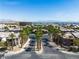 Street view of a condo community showcasing palm trees and lush landscaping at 8000 Badura Ave # 2174, Las Vegas, NV 89113