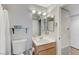 Bathroom view showcasing the toilet, vanity, and an array of mirrors at 8450 Alta Dr # 204, Las Vegas, NV 89145