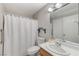 Bathroom with a white shower curtain, a toilet, vanity, and a mirror at 8450 Alta Dr # 204, Las Vegas, NV 89145