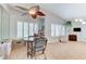 Dining area with a mirrored wall and view to the living room at 8450 Alta Dr # 204, Las Vegas, NV 89145