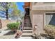 Exterior stairs leading to an upper-level unit, with decorative plants at 8450 Alta Dr # 204, Las Vegas, NV 89145