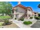 Two-story condo featuring a well-manicured landscape and stairs to the front door at 8450 Alta Dr # 204, Las Vegas, NV 89145