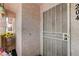 Inviting front door entrance with security screen door and decorative sunflower display at 8450 Alta Dr # 204, Las Vegas, NV 89145