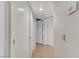 Hallway leading to bedrooms featuring neutral walls and ample storage space at 8450 Alta Dr # 204, Las Vegas, NV 89145