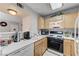 This bright kitchen offers essential appliances and ample counter space for cooking at 8450 Alta Dr # 204, Las Vegas, NV 89145