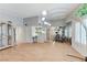 Open-concept living room featuring vaulted ceilings, wood floors, and a view into the kitchen and dining area at 8450 Alta Dr # 204, Las Vegas, NV 89145