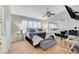 Comfortable main bedroom featuring large bed, mirrored closet, and ceiling fan at 8450 Alta Dr # 204, Las Vegas, NV 89145
