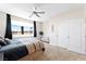 Airy bedroom featuring a large window with scenic views, comfortable bed, and a seating area at 9050 W Tropicana Ave # 1170, Las Vegas, NV 89147