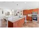Modern kitchen featuring a granite countertop island, pendant lighting, and stainless-steel appliances at 9050 W Tropicana Ave # 1170, Las Vegas, NV 89147