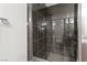 Modern bathroom with sleek shower design and dark granite style tile at 9050 W Tropicana Ave # 1170, Las Vegas, NV 89147