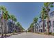 Street view showing palm tree lined street and building exteriors on either side at 9050 W Tropicana Ave # 1170, Las Vegas, NV 89147