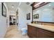 Well-lit bathroom featuring a vanity, toilet, and glass door shower with tile flooring at 9103 Alta Drive Dr # 407, Las Vegas, NV 89145