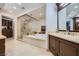 A luxurious bathroom featuring a soaking tub, walk-in shower, and custom cabinetry at 9103 Alta Drive Dr # 407, Las Vegas, NV 89145