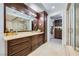 Spacious bathroom with walk-in shower, granite counters and dark wood vanity at 9103 Alta Drive Dr # 407, Las Vegas, NV 89145