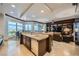 A luxurious kitchen with granite countertops, dark wood cabinetry, and stunning city views at 9103 Alta Drive Dr # 407, Las Vegas, NV 89145