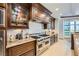 A chef's kitchen with pro-grade range and granite countertops at 9103 Alta Drive Dr # 407, Las Vegas, NV 89145