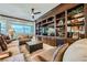 Comfortable living room featuring a built-in bookcase and entertainment center and floor-to-ceiling windows at 9103 Alta Drive Dr # 407, Las Vegas, NV 89145
