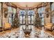 Ornate lobby featuring custom marble flooring, designer chandeliers, and seating near large windows at 9103 Alta Drive Dr # 407, Las Vegas, NV 89145