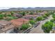 Lovely aerial view of a neighborhood of single Gathering homes with palm tree landscaping at 9375 Gold Lake Ave, Las Vegas, NV 89149