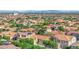 Beautiful shot of an expansive single Gathering home neighborhood against a mountain backdrop at 9375 Gold Lake Ave, Las Vegas, NV 89149